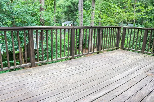 a view of balcony with wooden floor