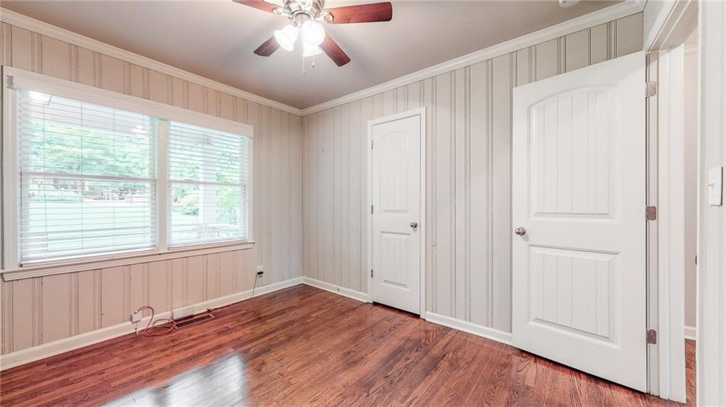 2305 Vistamont Drive Decatur, GA 30033 - Photo 20 of 28 a view of an empty room with wooden floor and a window