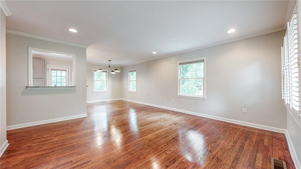 2305 Vistamont Drive Decatur, GA 30033 - Photo 5 of 28 a view of an empty room with wooden floor and a window