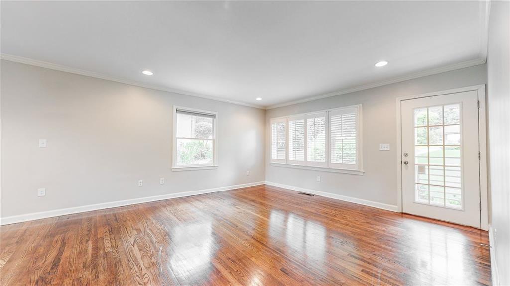 2305 Vistamont Drive Decatur, GA 30033 - Photo 6 of 28 a view of empty room with wooden floor and fan