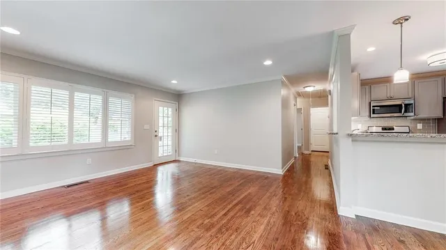 a view of kitchen with wooden floor