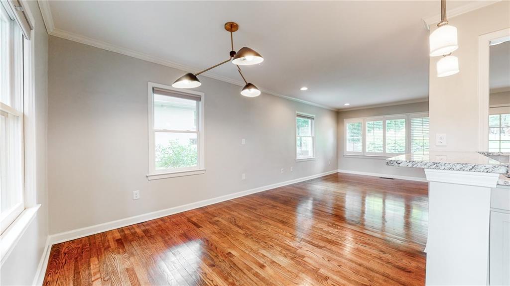 2305 Vistamont Drive Decatur, GA 30033 - Photo 10 of 28 a view of empty room with wooden floor and fan