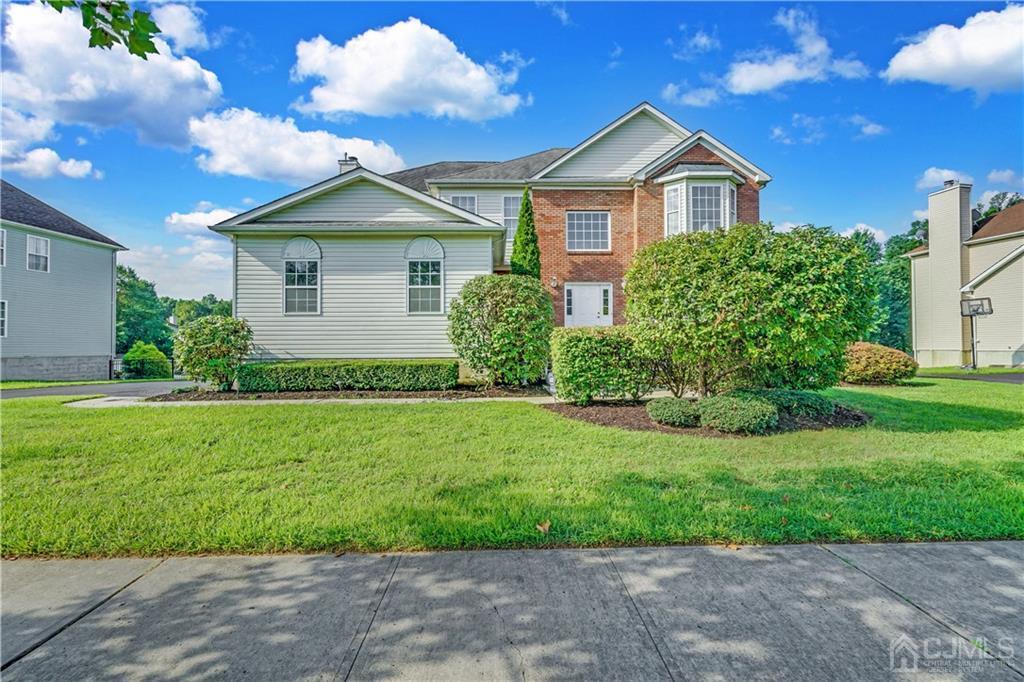 a front view of a house with a yard