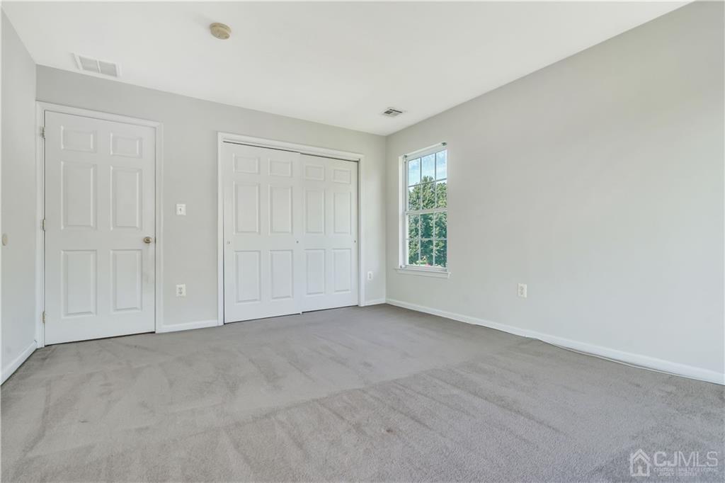 12 Mapleton Road Old Bridge, NJ 08857 - Photo 13 of 22 an empty room with windows