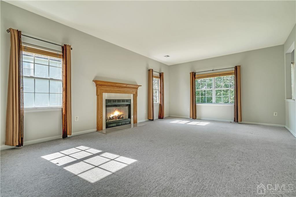 12 Mapleton Road Old Bridge, NJ 08857 - Photo 8 of 22 a view of an empty room with window and fire place
