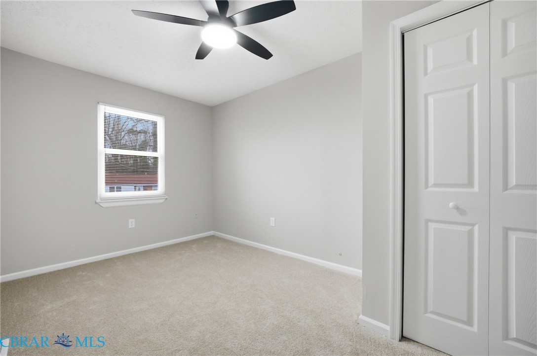 733 Spruce Street Hampton, VA 23661 - Photo 15 of 29 Unfurnished bedroom with light carpet and a ceiling fan
