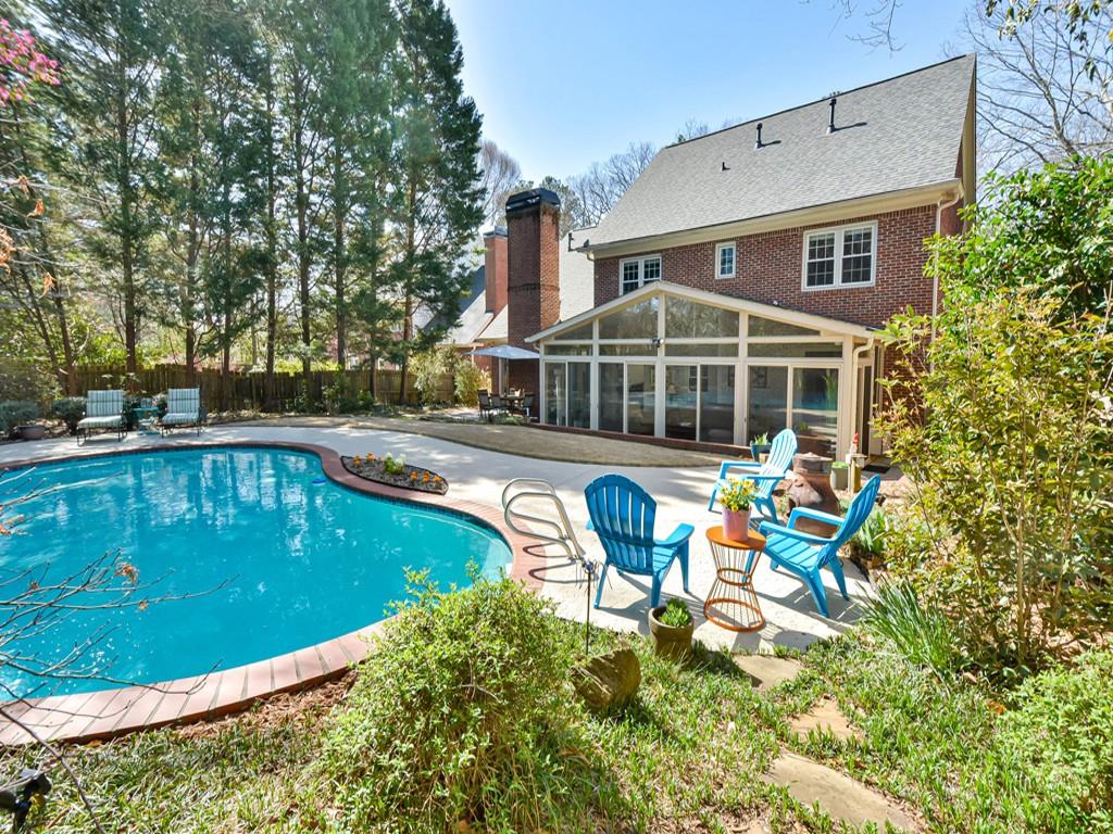 3080 Briarlake Road Northeast Decatur, GA 30033 - Photo 1 of 1 a view of a swimming pool with a lounge chairs