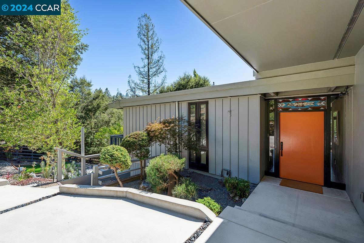 110 Orchard Road Orinda, CA 94563 - Photo 1 of 1 a view of a house with a small yard and plants