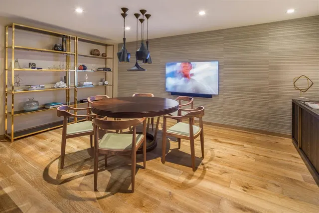 a room with furniture and a flat screen tv