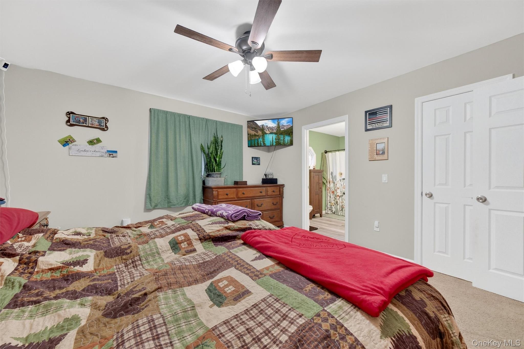 107 Marshall Road Salt Point, NY 12578 - Photo 15 of 26 a bedroom with a large bed and a chandelier