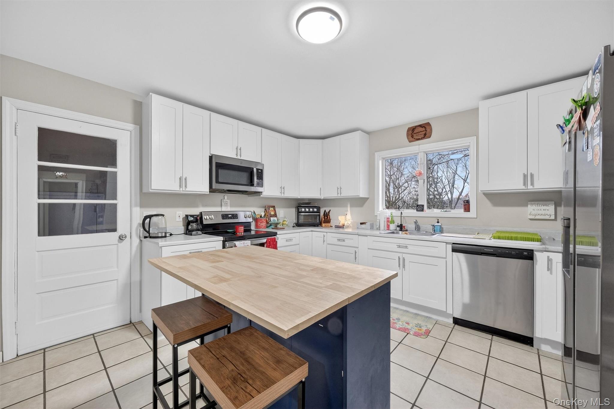 107 Marshall Road Salt Point, NY 12578 - Photo 2 of 26 a kitchen with granite countertop a stove a sink dishwasher and a refrigerator