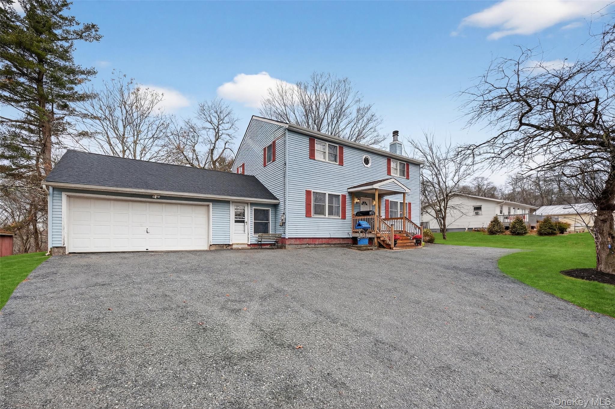 107 Marshall Road Salt Point, NY 12578 - Photo 6 of 26 a view of a house with a yard and garage