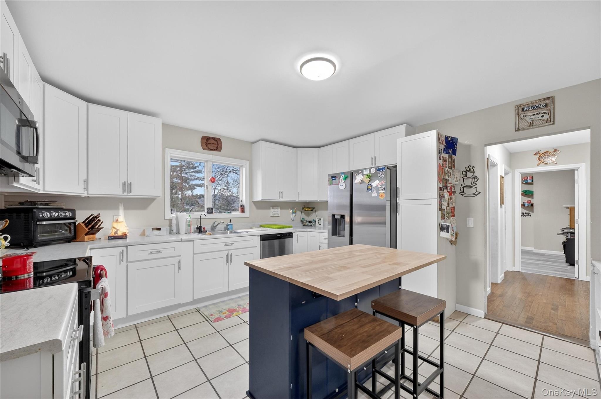 107 Marshall Road Salt Point, NY 12578 - Photo 9 of 26 a kitchen with a dining table cabinets and refrigerator