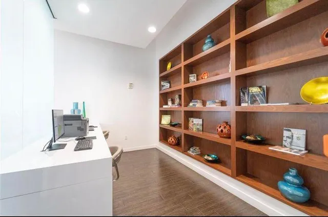 a room with a book shelf and a shelf