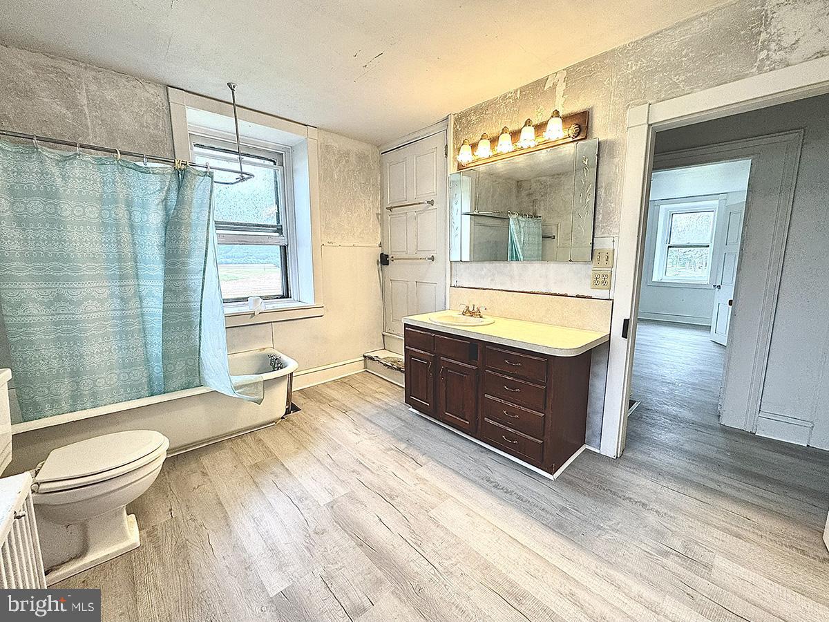 133 Hunter Road Oley, PA 19547 - Photo 23 of 44 a spacious bathroom with a tub sink toilet and a mirror