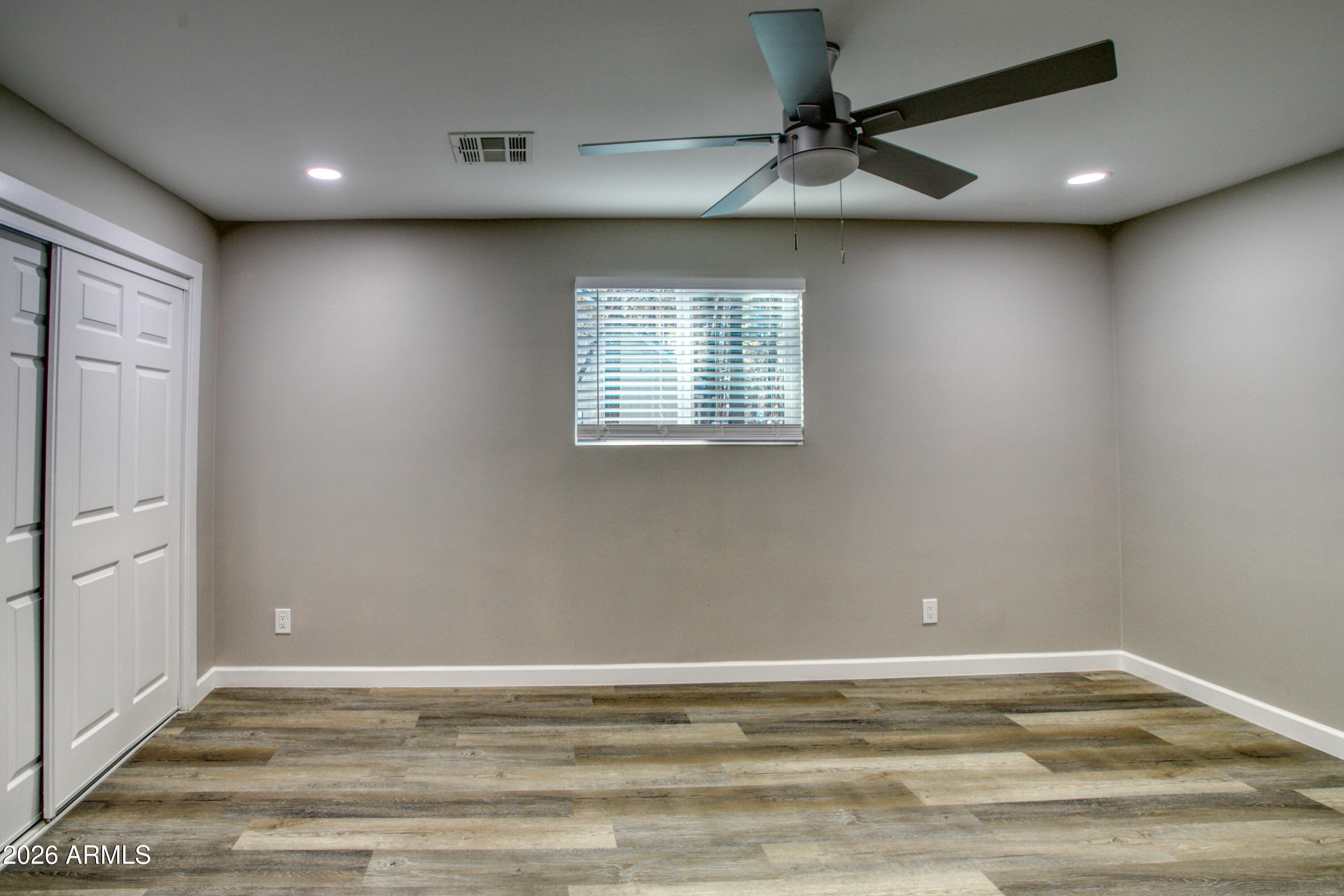 5298 Pine Dawn Road Lakeside, AZ 85929 - Photo 12 of 19 an empty room with a window and a ceiling fan