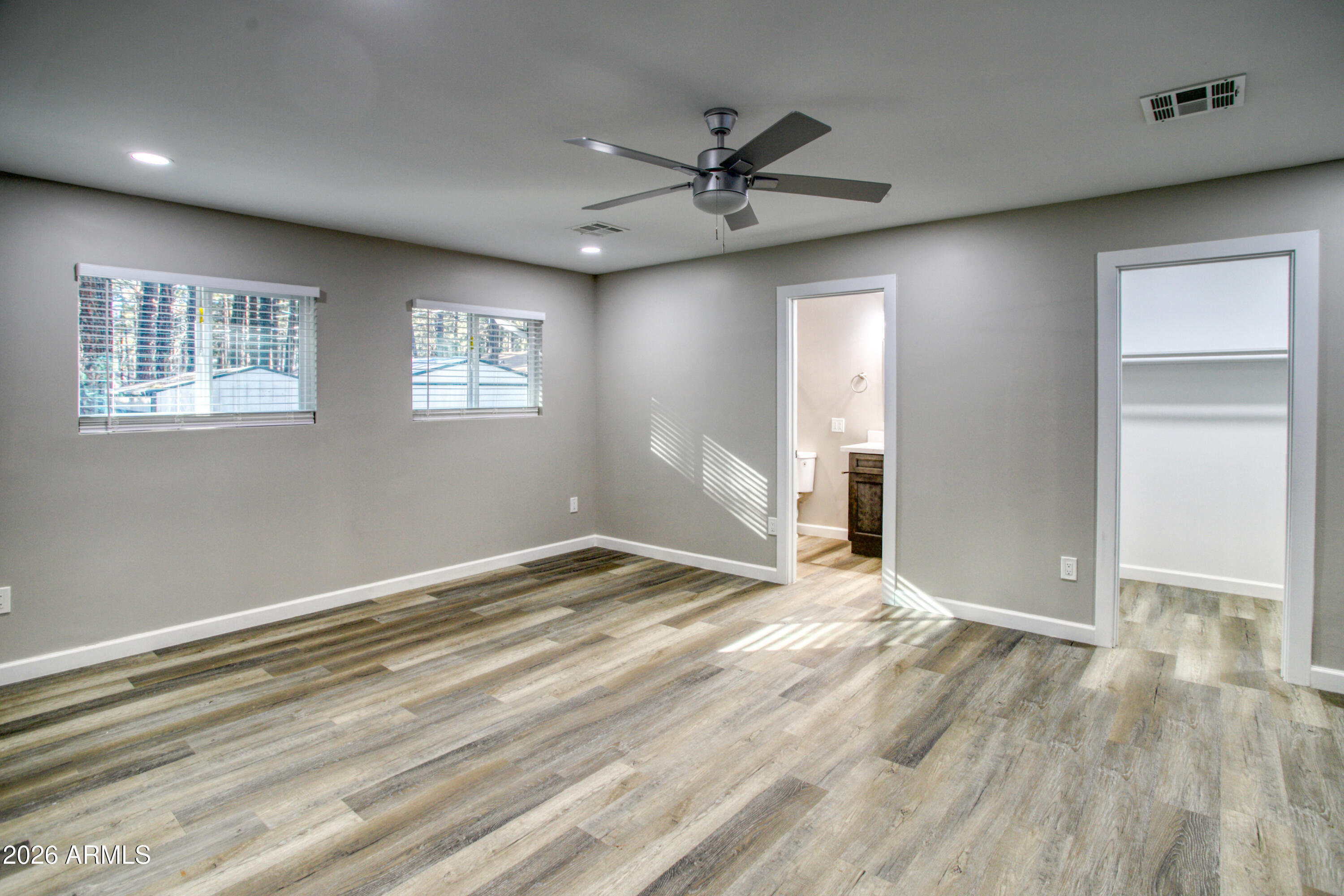 5298 Pine Dawn Road Lakeside, AZ 85929 - Photo 14 of 19 a view of empty room with wooden floor and fan