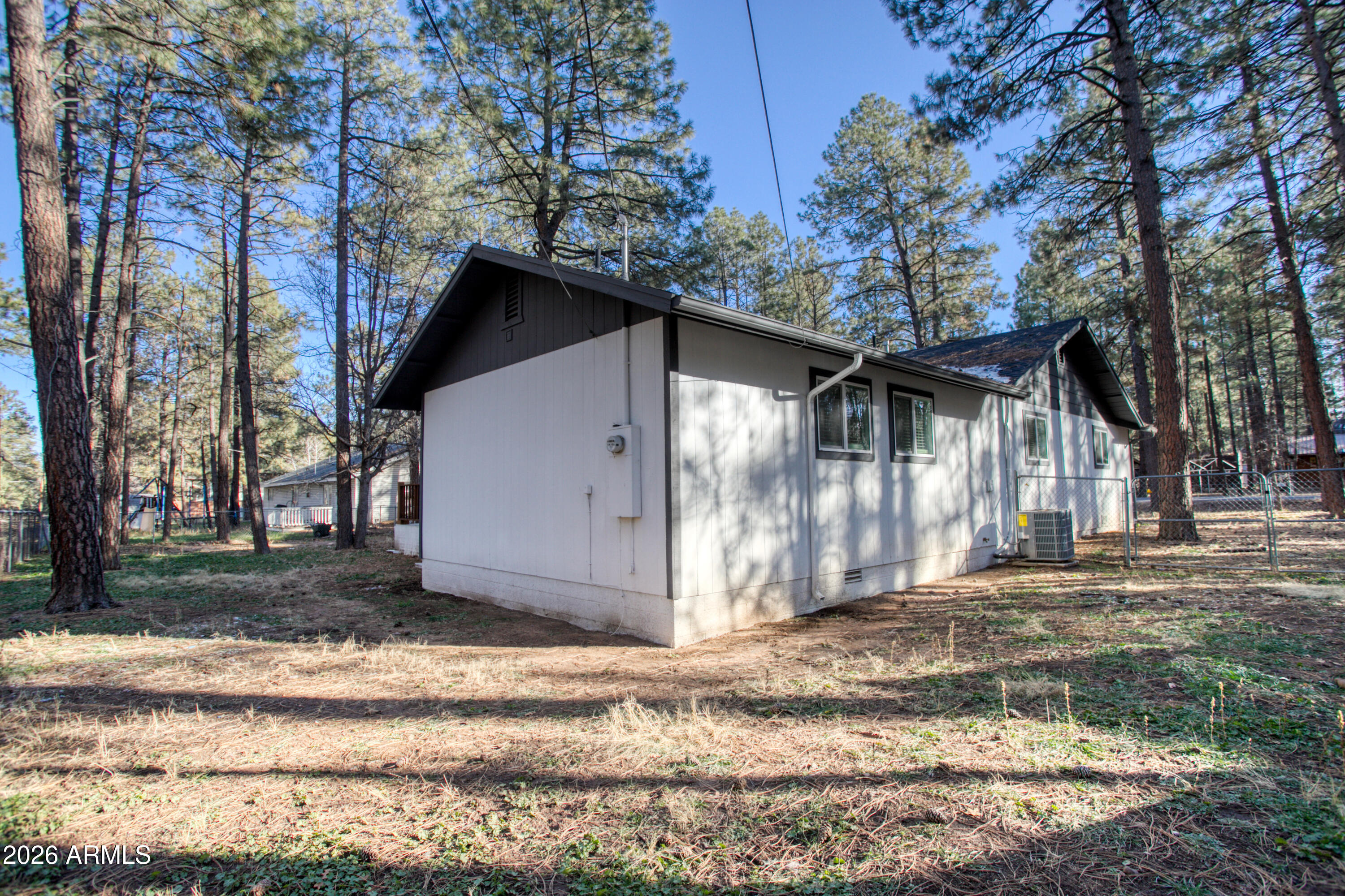 5298 Pine Dawn Road Lakeside, AZ 85929 - Photo 19 of 19 a front view of a house with a yard and garage