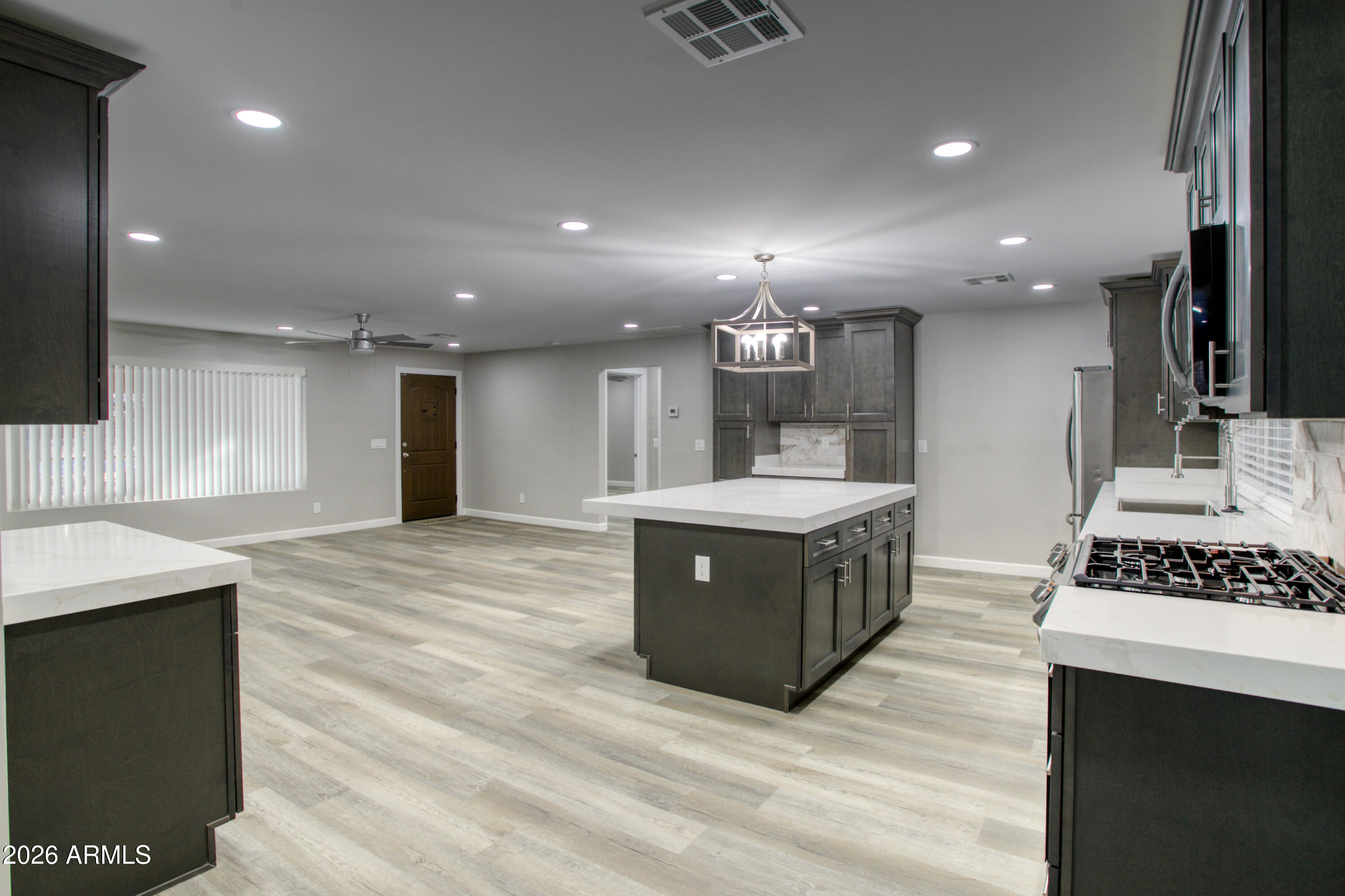 5298 Pine Dawn Road Lakeside, AZ 85929 - Photo 6 of 19 a kitchen with stainless steel appliances kitchen island a cabinets and wooden floor