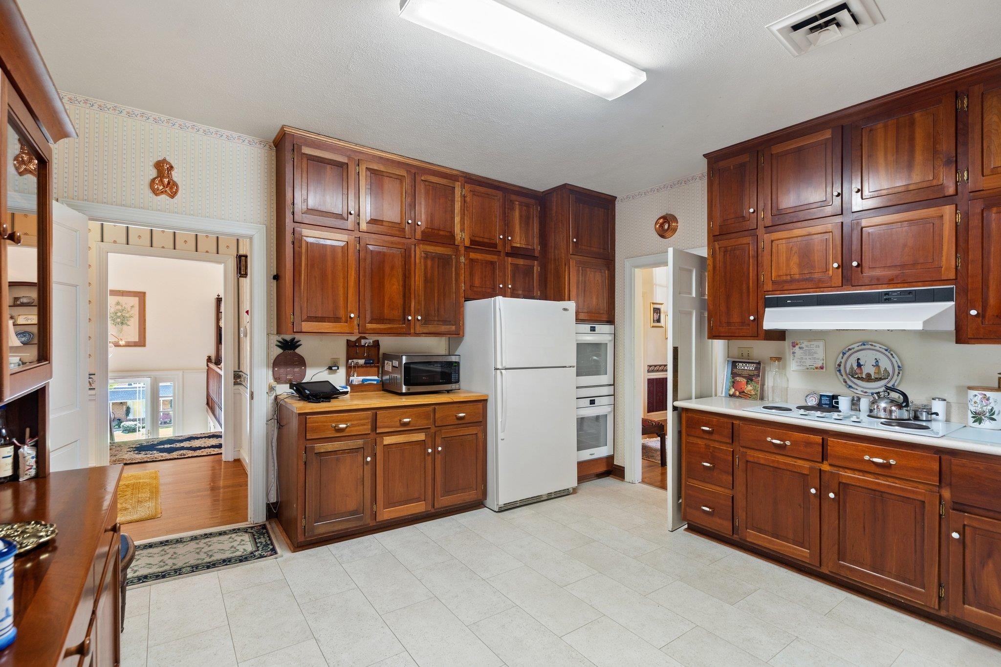 500 Wakefield Circle Staunton, VA 24401 - Photo 24 of 70 a kitchen with stainless steel appliances granite countertop a refrigerator and wooden cabinets