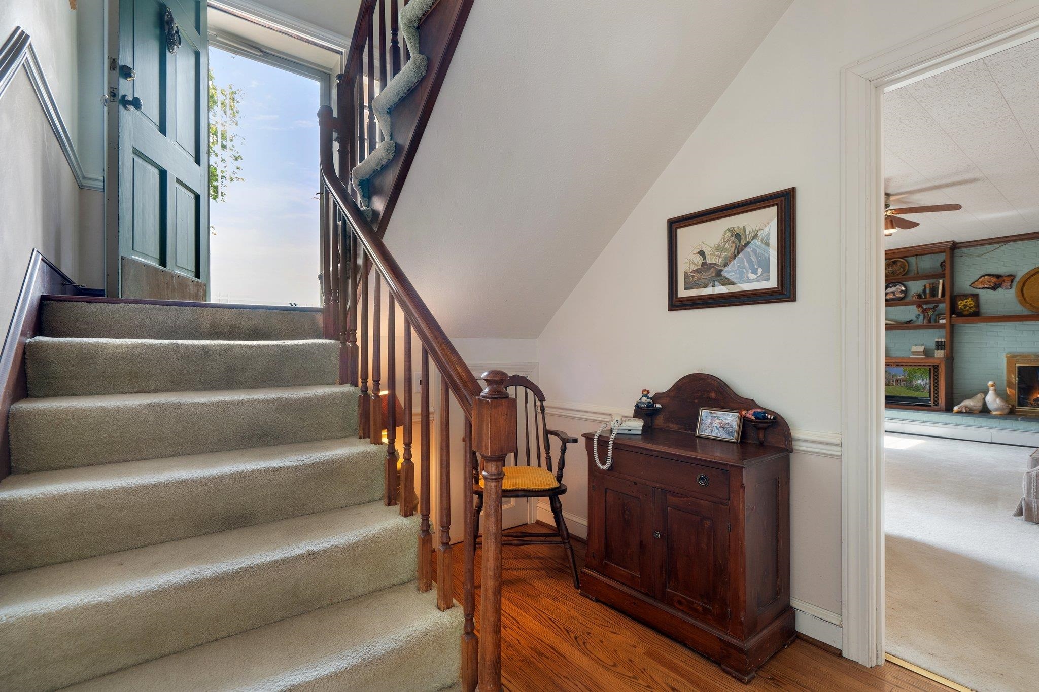 500 Wakefield Circle Staunton, VA 24401 - Photo 45 of 70 a view of staircase with lots of frames on wall and a view of a staircase