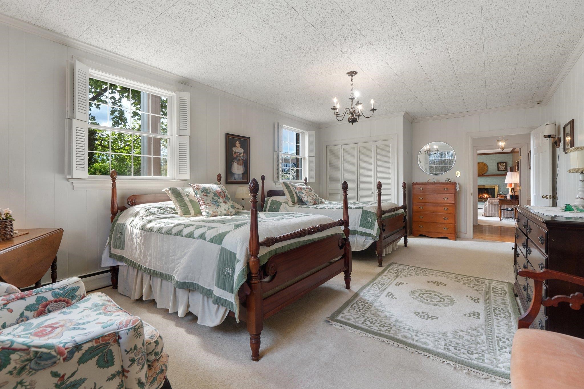 500 Wakefield Circle Staunton, VA 24401 - Photo 50 of 70 a bedroom with a bed and a chandelier