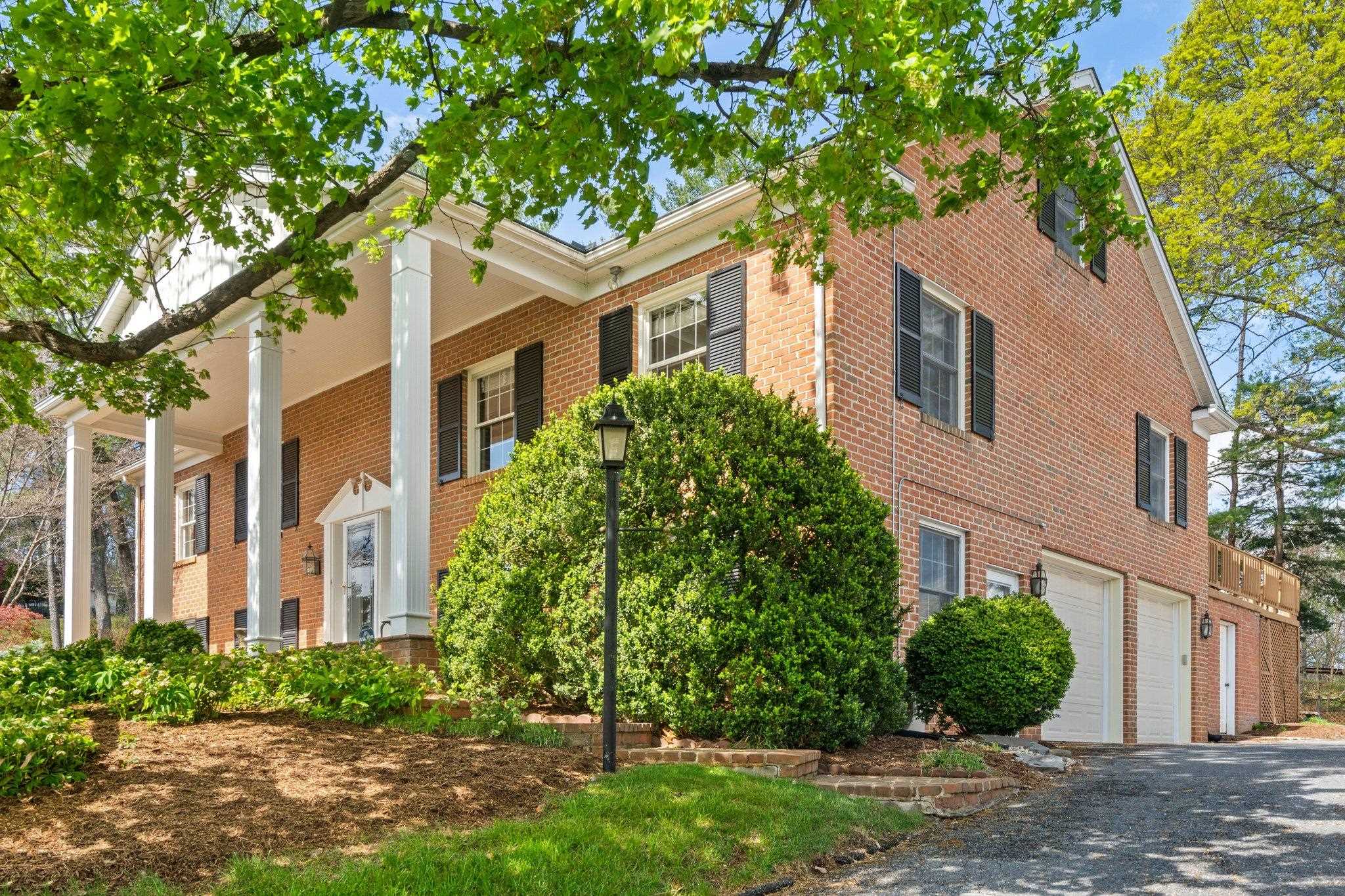 500 Wakefield Circle Staunton, VA 24401 - Photo 7 of 70 front view of a white house with a yard and plants