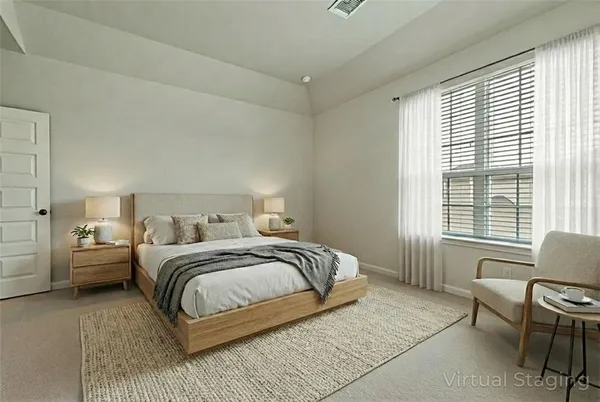 a bedroom with a bed and a couch