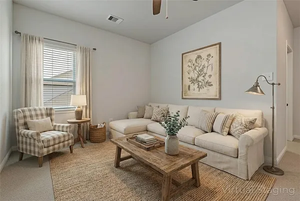 a living room with furniture and a couch