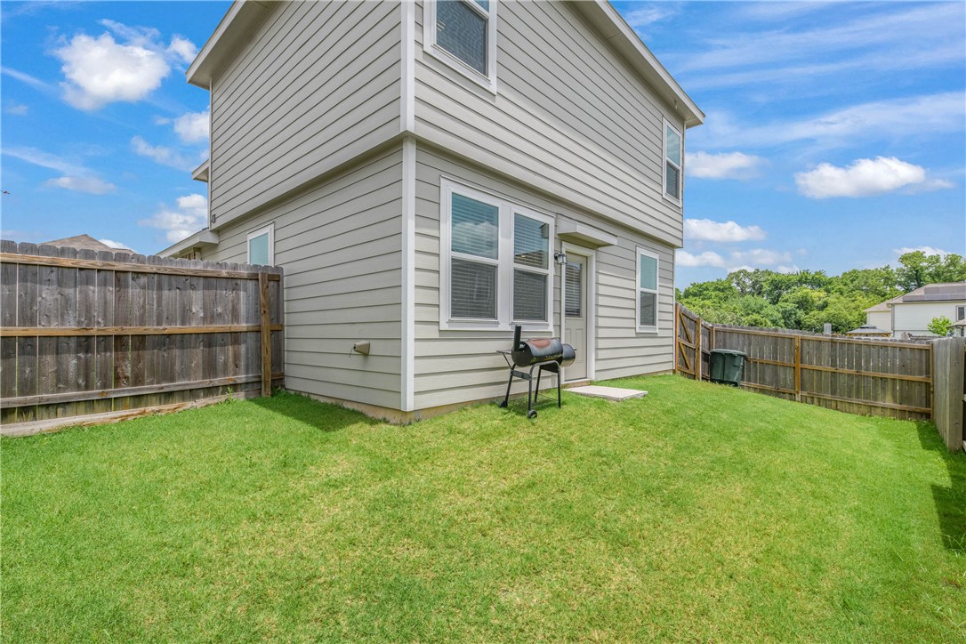 1415 Desire Lane Bryan, TX 77803 - Photo 22 of 24 a backyard of a house with table and chairs