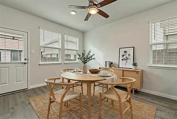 a view of a dining room with furniture and window