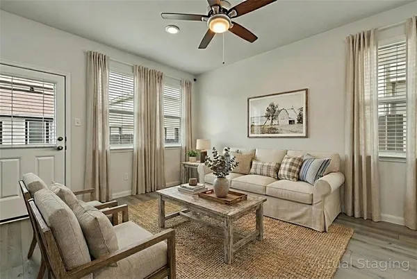 a living room with furniture and windows