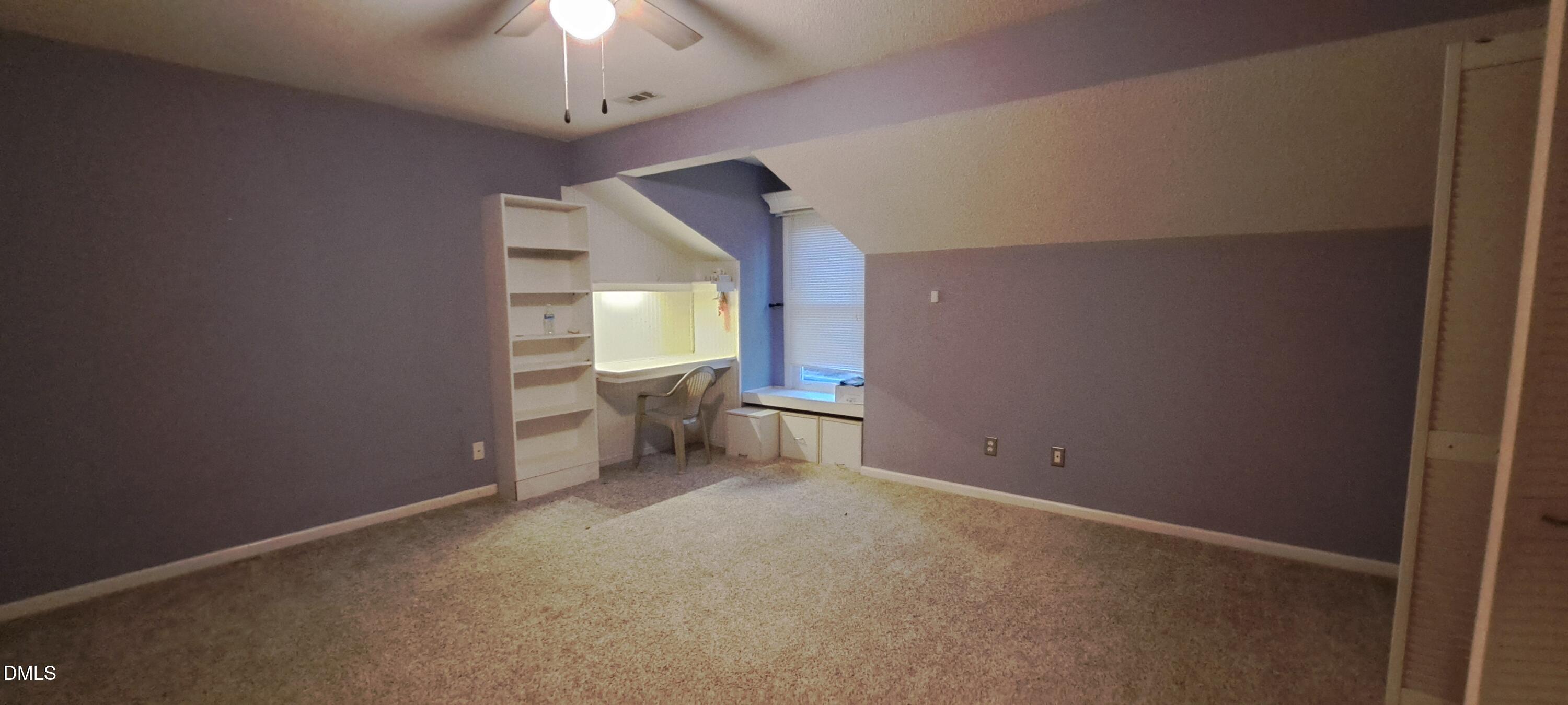 2501 St Christopher Circle Southwest, Unit 6 Wilson, NC 27893 - Photo 9 of 10 wooden floor in an empty room with a window