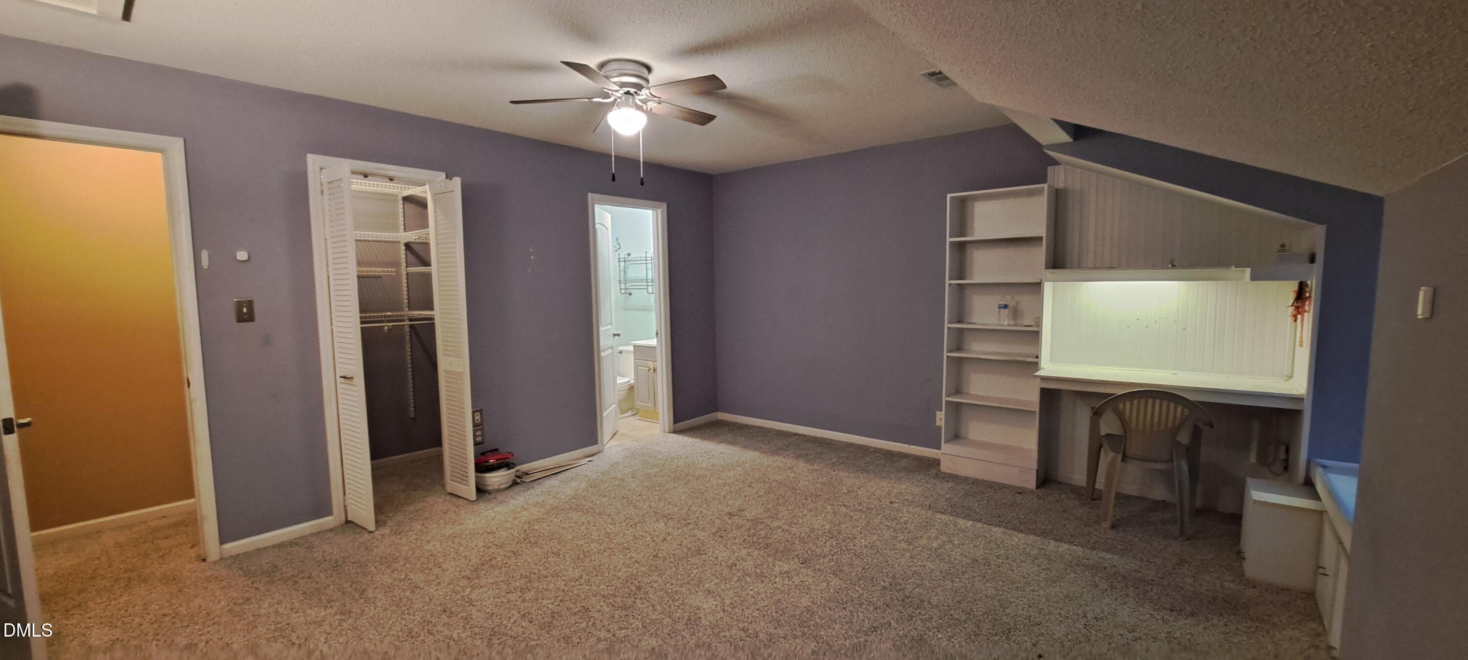 2501 St Christopher Circle Southwest, Unit 6 Wilson, NC 27893 - Photo 10 of 10 an empty room with windows cabinet and mirror