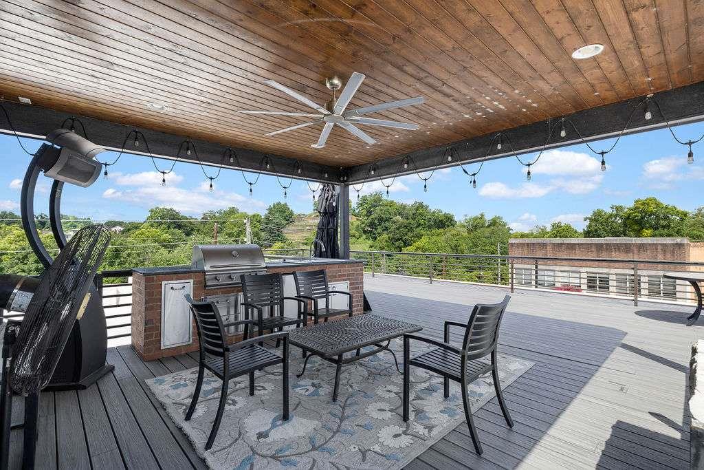100 Broad Street Rome, GA 30161 - Photo 25 of 93 a patio with wooden floor a barbeque oven and outdoor seating