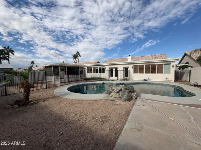 a view of a house with swimming pool