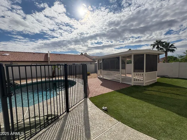 a view of a roof deck with wooden fence