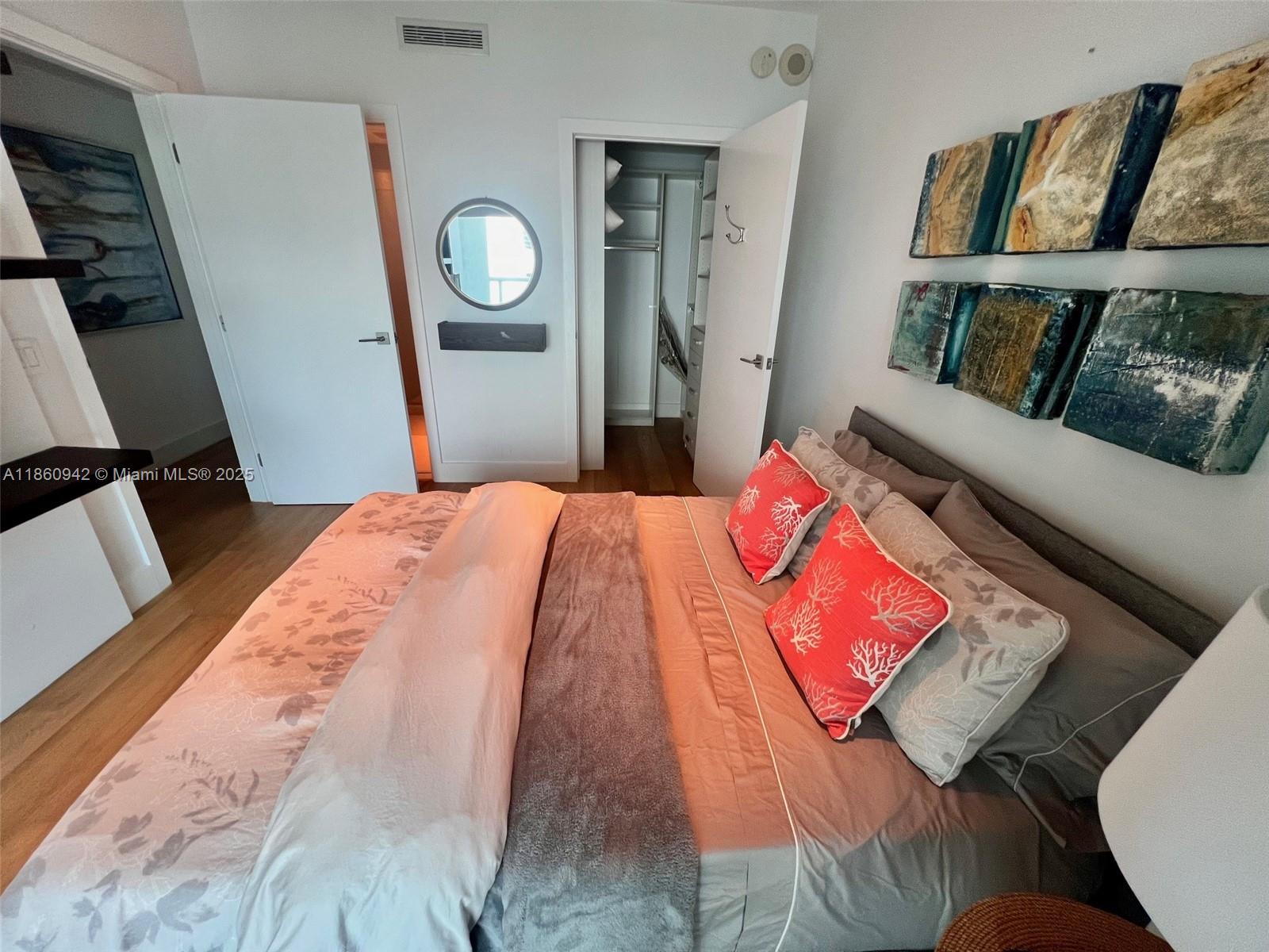 3801 Collins Avenue, Unit 705 Miami Beach, FL 33140 - Photo 14 of 18 a bedroom with a bed and a window