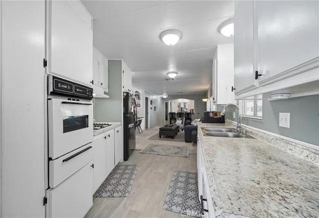 a view of a living room kitchen appliances and a counter top space