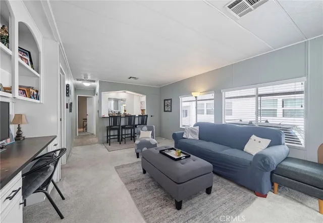 a living room with furniture and a table