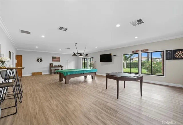 a living room with furniture a rug and a large window