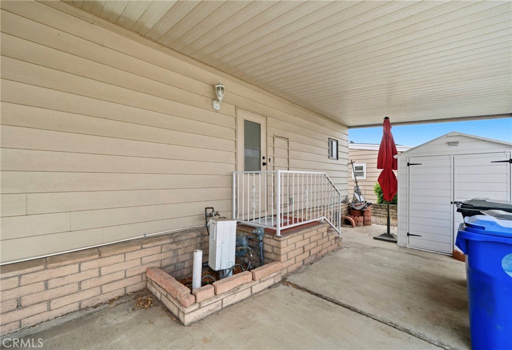 9800 Base Line Road, Unit 79 Rancho Cucamonga, CA 91701 - Photo 5 of 30 Drive way back entry point with storage