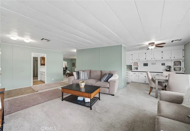 a living room with furniture and a table