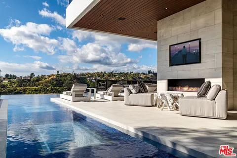 a view of a living room and a flat screen tv