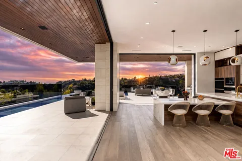 a view of roof deck with patio