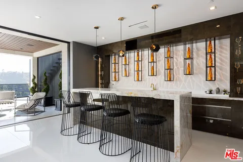 a kitchen with granite countertop a stove and a sink