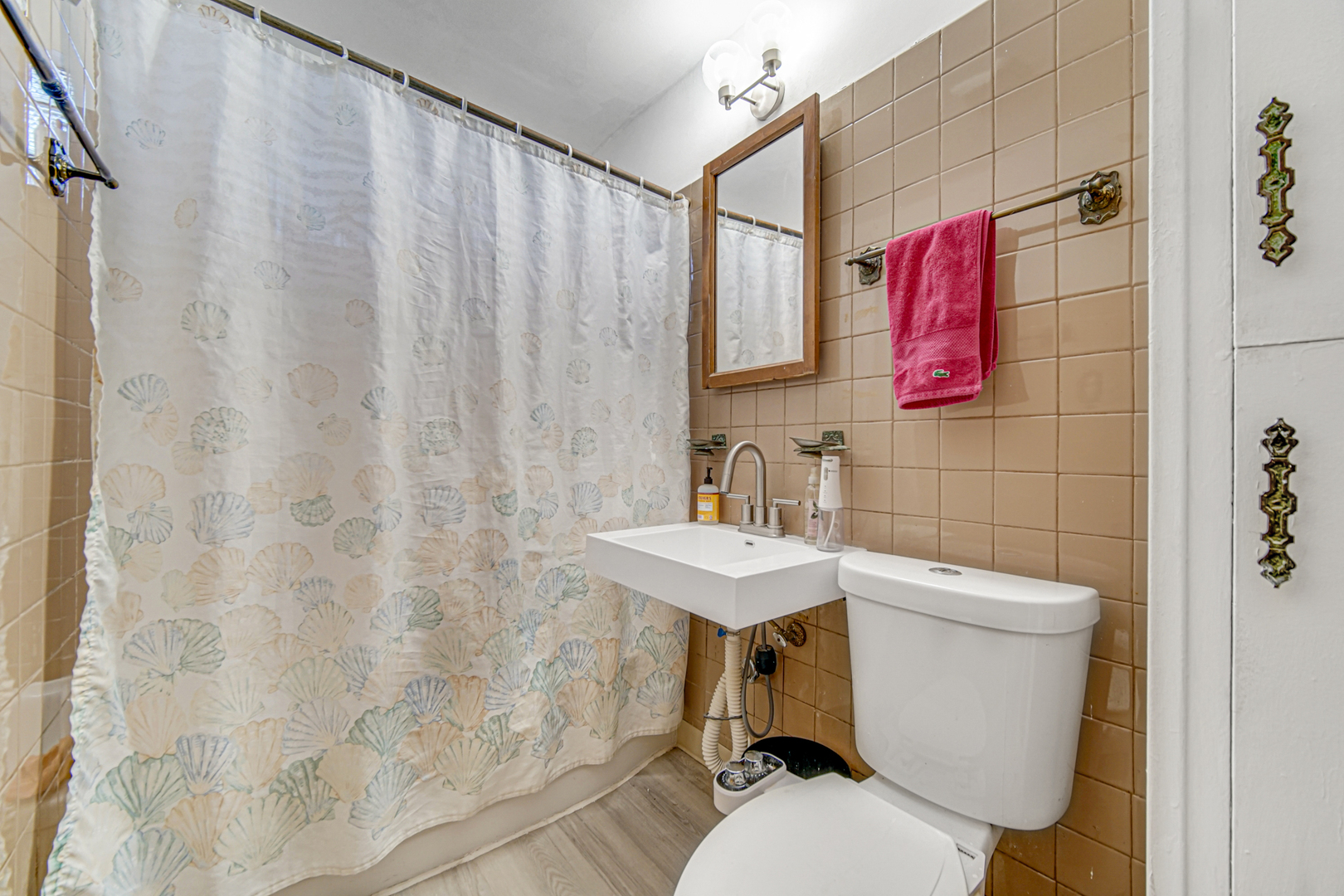 17423 Walter Street Lansing, IL 60438 - Photo 11 of 21 a bathroom with a sink toilet and shower