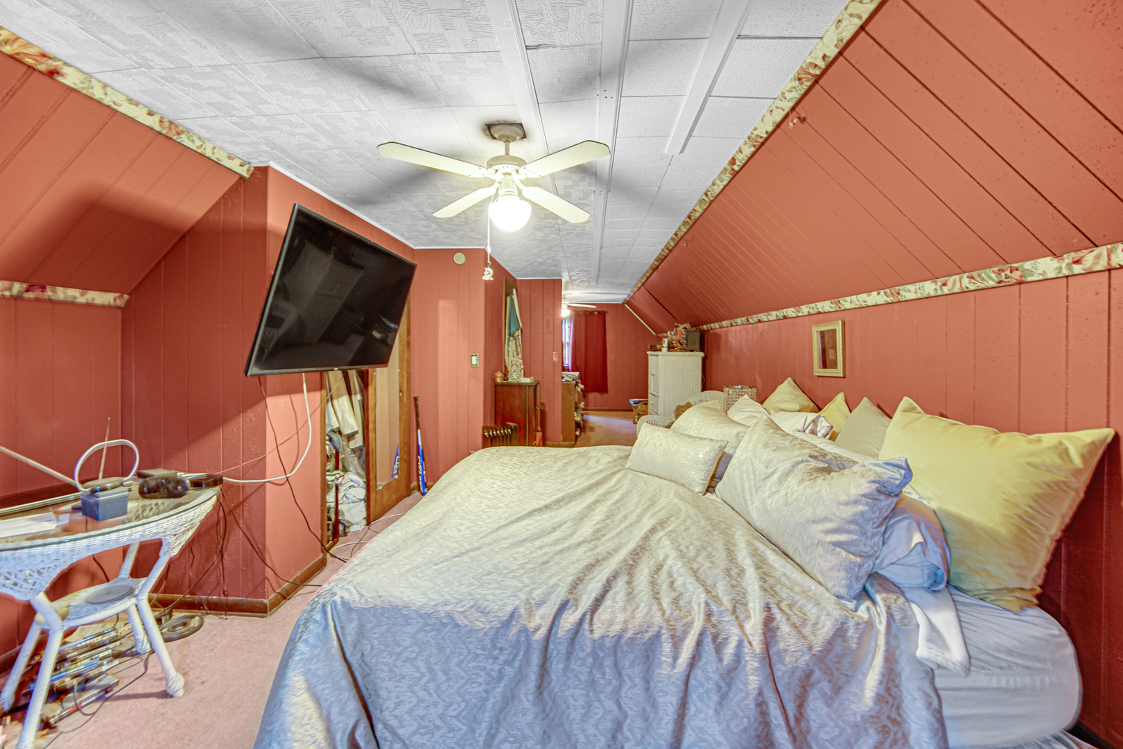 17423 Walter Street Lansing, IL 60438 - Photo 15 of 21 a bedroom with a bed a flat screen tv and a chandelier