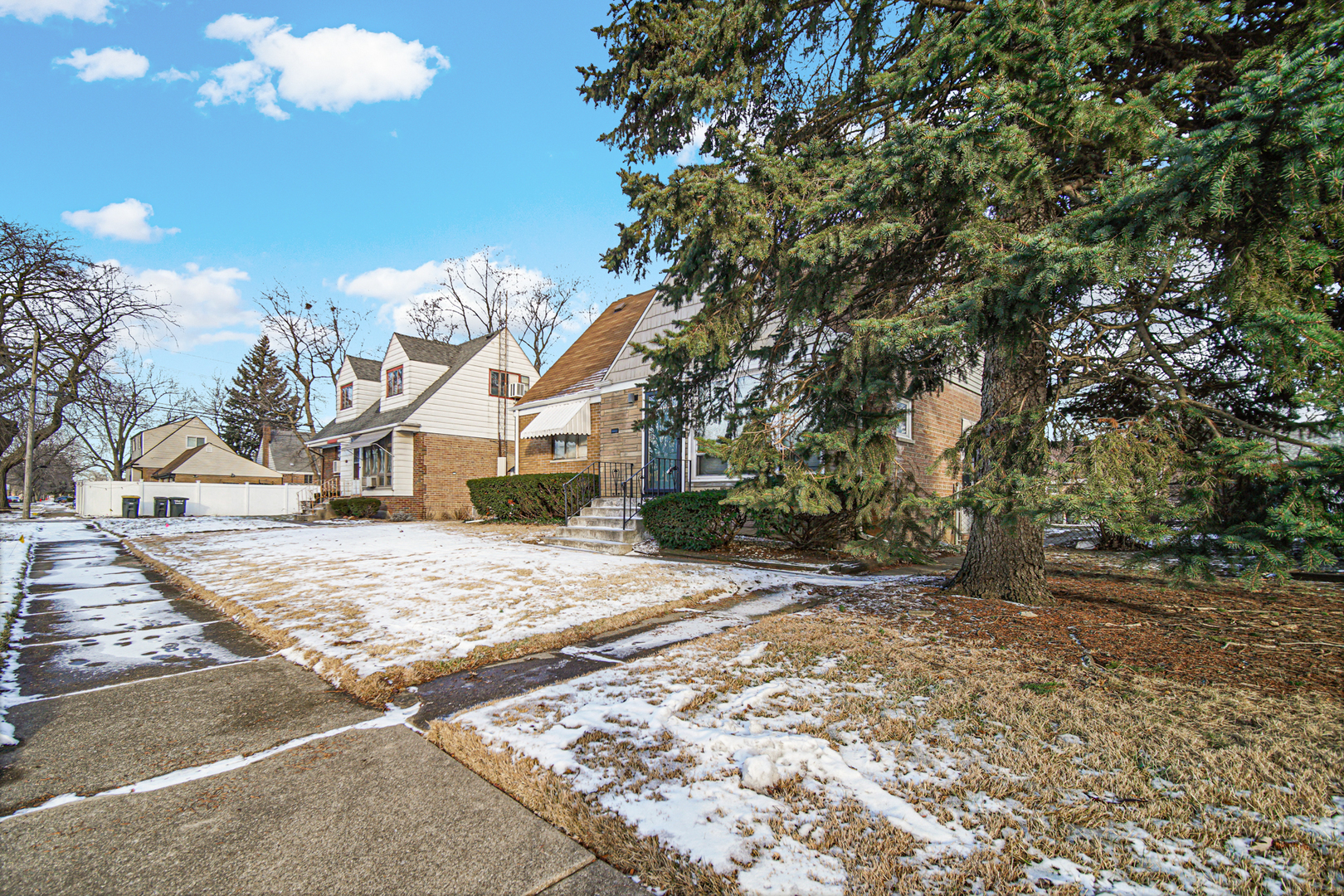 17423 Walter Street Lansing, IL 60438 - Photo 4 of 21 a front view of a house with a yard