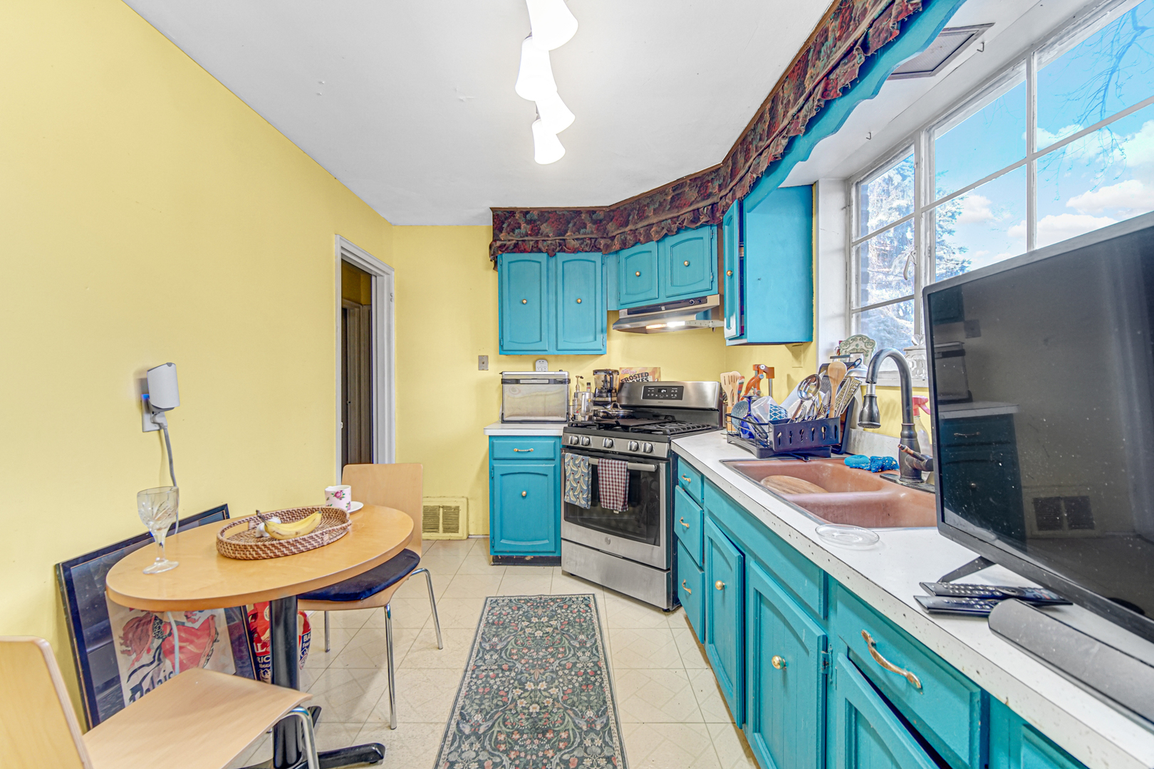 17423 Walter Street Lansing, IL 60438 - Photo 6 of 19 a kitchen with stainless steel appliances granite countertop a sink stove and refrigerator